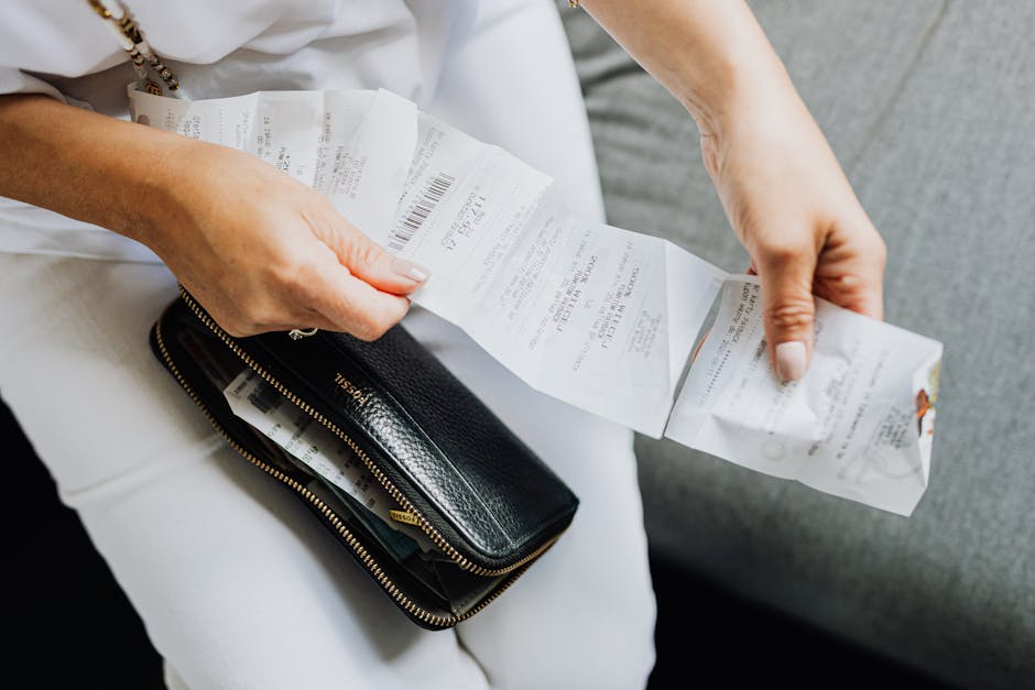 Accountant reviewing printed receipts with client