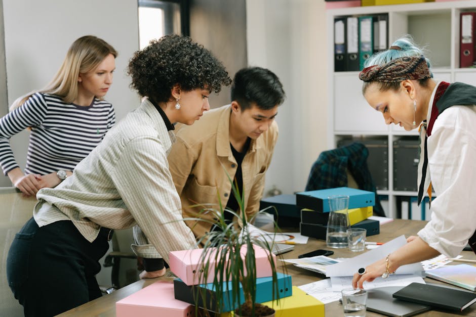 Small business team reviewing expenses on tablet